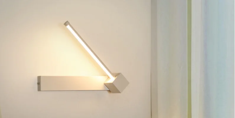 AC90 - 260V Bedroom Bedside Wall Light. Made of aluminum, this simple light fixture features a 330° rotatable adjustable light angle for versatile illumination.