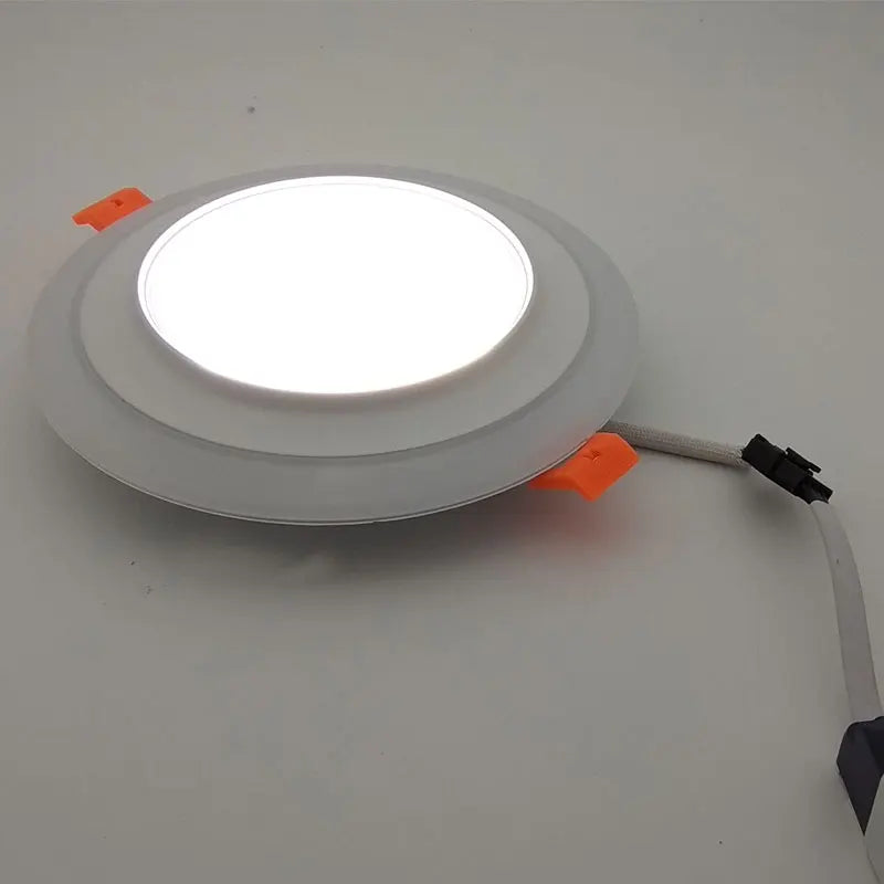 CE & ROHS - Certified Double - Color Round LED Panel Downlights. Available in 5W, 9W, 16W, 24W, with 3 modes, suitable for recessed ceiling installation and operating on AC85 - 265V.